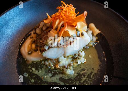 Lutefisk, traditional dish of some Nordic countries, Norwegian cuisine, Traditional assorted dishes in Maaken restaurant. Lovund island, Nortern Norwa Stock Photo