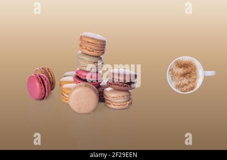 macaroons and cup of coffee  on beige background Stock Photo
