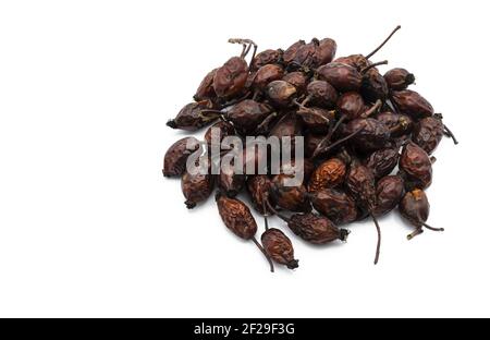 Ripe and dried rose hips isolated on white background Stock Photo