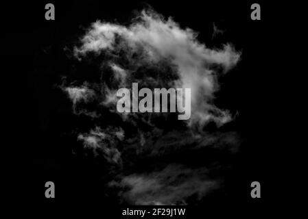 Isolated clouds on a plain black background. Stock Photo
