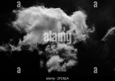 Isolated clouds on a plain black background. Stock Photo