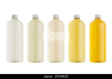 Assortment of plastic tall bottles with cosmetic produce, oil, beverage or perfume of different pastel pale colors, silver cap mockup, isolated,  temp Stock Photo