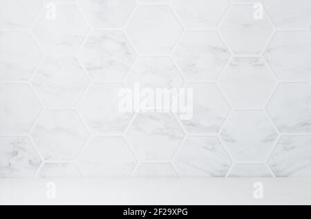 Light white grey marble hexagon tile wall with white wood board as floor, empty interior of kitchen, bathroom for design. Stock Photo