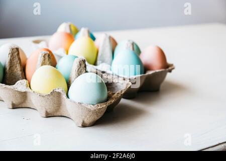 Cartons of dyed eggs ready for Easter Stock Photo