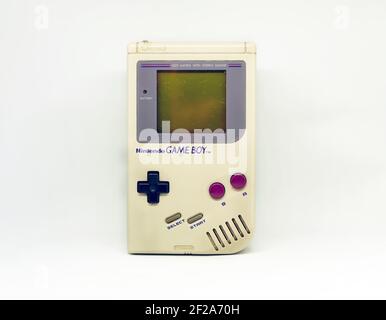 Rome, Italy, December 23, 2020: The Gameboy portable video game console from Nintendo isolated on a white background. Vintage video game console from Stock Photo