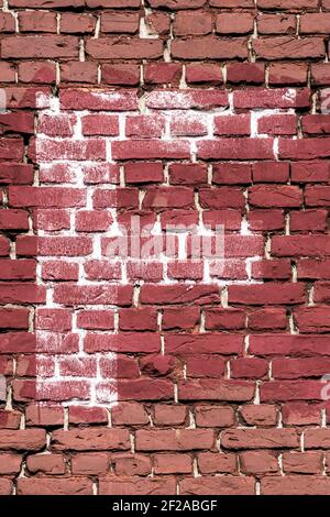 The letter F painted white on a red brick wall Stock Photo