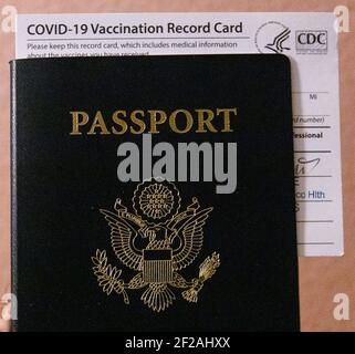 USA. 11th Mar, 2021. An illustration of a United States Passport with Covid-19 Vaccination Record Card in a home in San Diego, California on Thursday, March 11, 2021. Some European countries such as Spain, Georgia, Greece, and Denmark will allow international travelers who have received the COVID-19 vaccine. (Photo by Rishi Deka/Sipa USA) Credit: Sipa USA/Alamy Live News Stock Photo