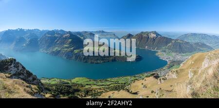 A mesmerizing view to Lake Lucerne with Rigi and Pilatus mountains, Brunnen town from Fronalpstock Stock Photo