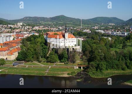 Decin historic town panoramic aerial view with Labe River and Decin Castle on the hill, Czech Republic Stock Photo