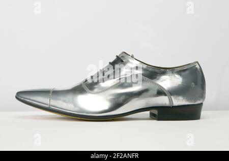 Elegant footwear personal accessory for men. Steel life studio shoot. Stock Photo