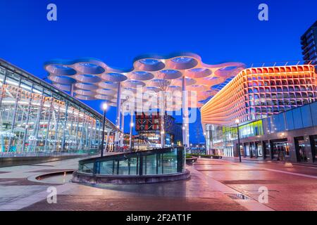 UTRECHT, NETHERLANDS - FEBRUARY 28, 2020: Utrecht Centraal Railway Station from Station Square with Hoog Catharijne shopping mall at twilight.