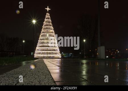 Xmas Tree, Christmas tree, illumination, city lights, reflections, Christmas tree made from led lights reflection in wet footpath Stock Photo