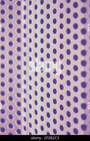 Background of metal mesh grid with round holes, close-up Stock Photo