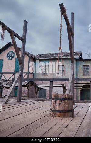 Place of execution of criminals in the old days-the block and the gallows on a wooden platform Stock Photo
