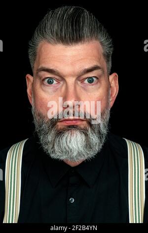 Tilburg, Netherlands. Studio portrait of a mid adult, caucasian male with mustage and beard. Stock Photo