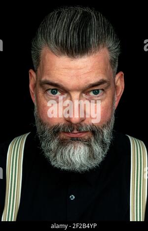 Tilburg, Netherlands. Studio portrait of a mid adult, caucasian male with mustage and beard. Stock Photo