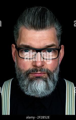 Tilburg, Netherlands. Studio portrait of a mid adult, caucasian male with mustage and beard. Stock Photo
