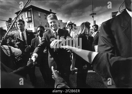 Bill Clinton shaking hands with the cowds in the black area of Philladelphia Stock Photo