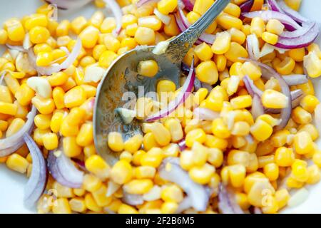 Corn and onion salad . Healthy eating from cereals Stock Photo