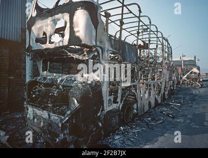 BELFAST, UNITED KINGDOM - AUGUST 1976. petrol bombed Belfast City bus in depot during The Troubles, Northern Ireland, 1970s Stock Photo