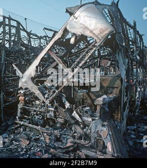 BELFAST, UNITED KINGDOM - AUGUST 1976. petrol bombed Belfast City bus in depot during The Troubles, Northern Ireland, 1970s Stock Photo