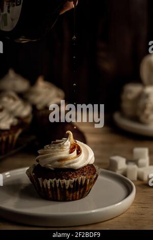 Cupcake on a dessert table background. Stock Photo