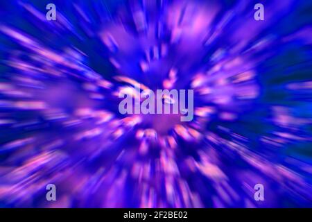 Purple and pink abstract background - radially acceleraed boiling water in a glass pot, Bubbles and splashes blurred. Stock Photo