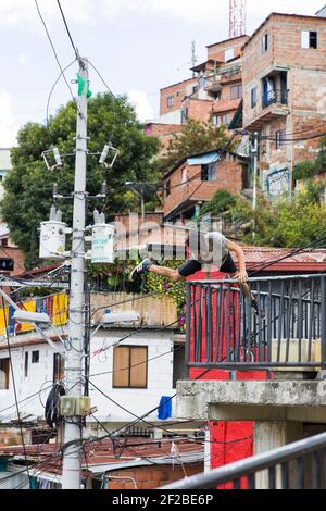 MEDELLIN, COLOMBIA - SEPTEMBER 12, 2019: Unidentified man at Comuna 13 in Medellin, Colombia. Once known as Colombias most dangerous barrio, today gra