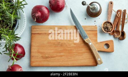 empty wooden cutting board and knife on kitchen table, top view Stock Photo
