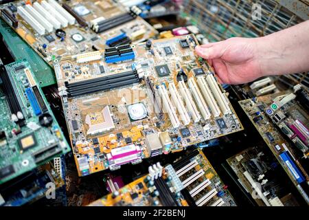 Norden, Deutschland. 13th May, 2020. Numerous circuit boards in a box of an electronic waste sorting company in Norden (Germany), 13 May 2020. Credit: dpa/Alamy Live News Stock Photo