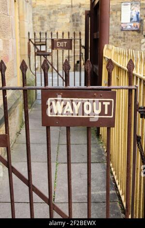 Old fashioned way out and exit sign at the preserved heritage steam railway in Llangollen North Wales Stock Photo