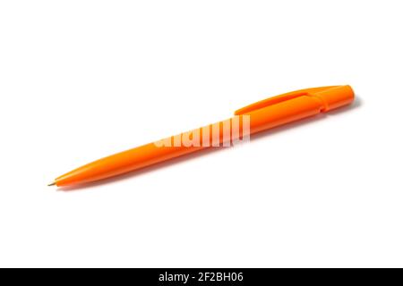 Orange ballpoint pen on white Stock Photo