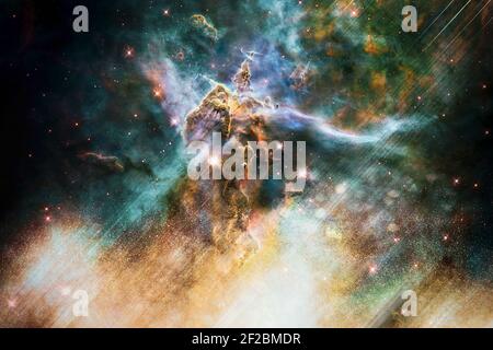 Artist rendition of the Mystic Mountain of Carina Nebula. Deep space look. Science fiction wallpaper. Elements of this image were furnished by NASA. Stock Photo