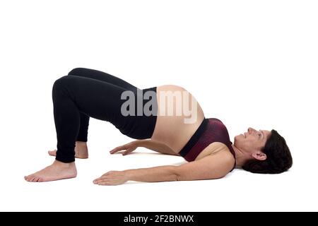 pregnant woman doing exercises on white background Stock Photo