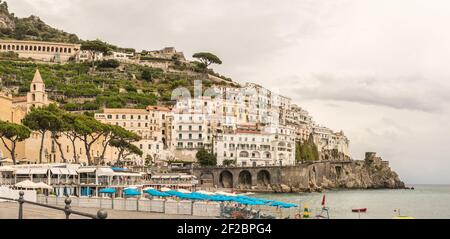 Panoramic view of beautiful Amalfi in grey colours in autums on hills leading down to coast, Campania, Italy. Amalfi coast is most popular travel and Stock Photo