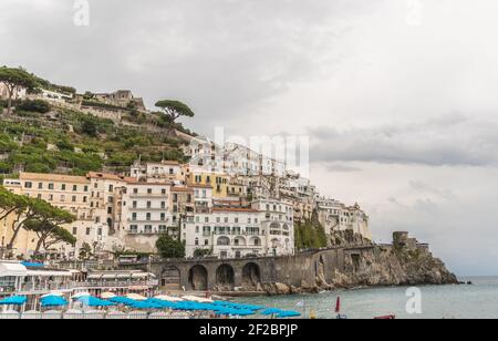 Panoramic view of beautiful Amalfi in grey colours in autums on hills leading down to coast, Campania, Italy. Amalfi coast is most popular travel and Stock Photo
