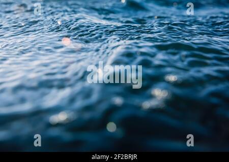 Water texture with waves, bokeh and drops Stock Photo