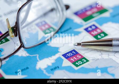 Glasses and pen lie on a newspaper Stock Photo