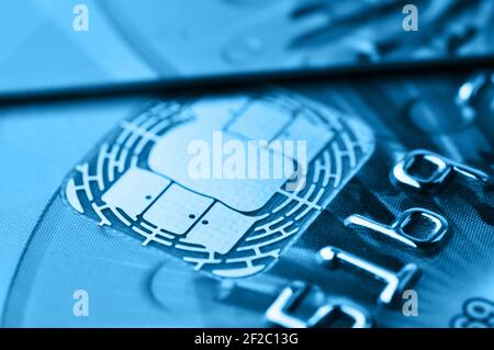 Credit cards. Blue toned. Business. E-commerce concept. Shallow depth of field. Selective focus. Macro shot. Stock Photo