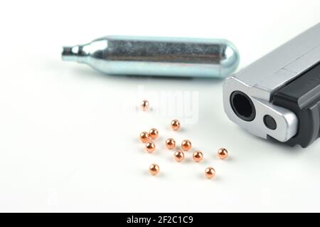 Air Gun, Co2 Cartridges and Pellets. Focus on a gun barrel. Stock Photo
