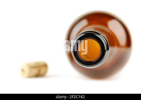 Empty wine bottle with cork isolated on a white. Selective focus. Stock Photo