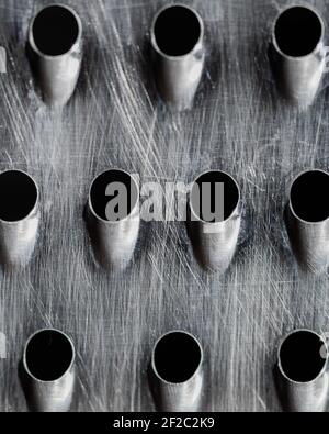 close up of a scratched metal box grater Stock Photo