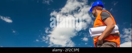 Professional construction designer with plans or projects looking for a new buildings realization Stock Photo