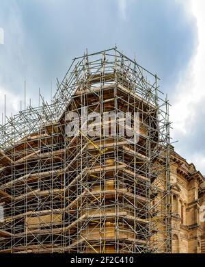 Scaffolding around a building renovating facade Stock Photo