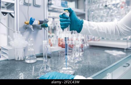 Pharmacist developing the new a drugs and pills in the pharmacy laboratory Stock Photo