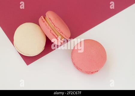 Fresh natural colorful macarons, abstract sweet art, romantic gift. Minimal sweet food concept. Flat lay, top view Stock Photo