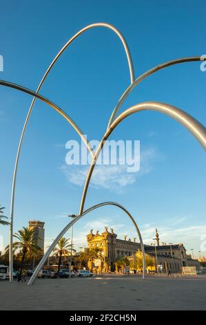 Onades Waves Sculpture by Andreu Alfaro with Aduana building in port vell area, Barcelona, Catalonia, Spain Stock Photo