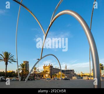 Onades Waves Sculpture by Andreu Alfaro with Aduana building in port vell area, Barcelona, Catalonia, Spain Stock Photo