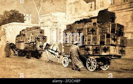 WWI- An old wartime printed photograph of  Red Cross supplies being transported to the Anzac hospital at Alexandria.  In the Gallipoli campaign, many troops were transported to  hospitals in Egypt and Malta. Stock Photo