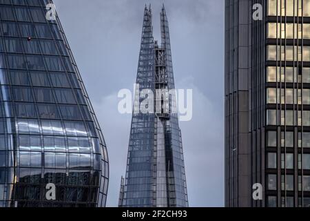 London's iconic Shard building stands amongst other London Skyscrapers in the capital's skyline, London, England, United Kingdom Stock Photo